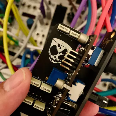 The back of the module. Divkids logo is printed on the PCB.