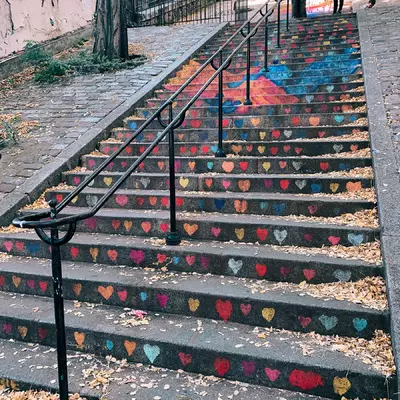 The stairs of Montmartre with each step decorated as a fresco when viewed from the bottom