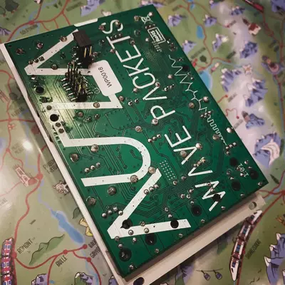 A green circuit board with white text reading 
