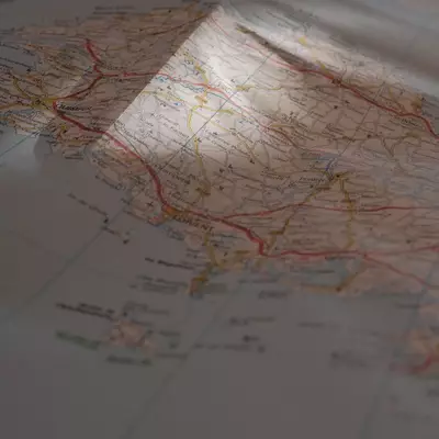 A paper map of France showing Britanny