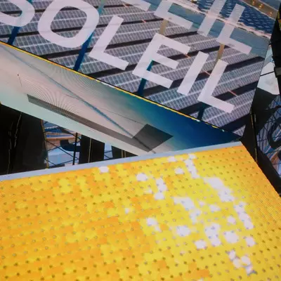 Close-up of angled LED screens displaying the word 