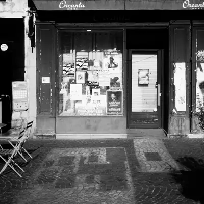 Black and white shot of the façade of a café called 