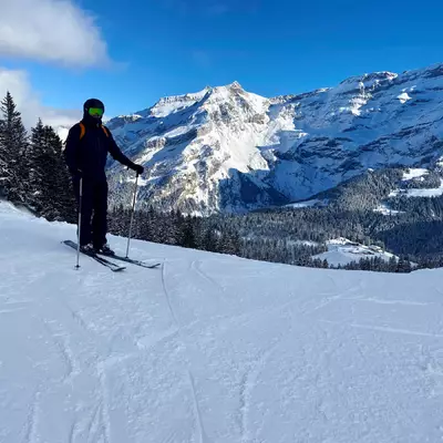 Cédric in ski gear with the Diablerets massif in the background