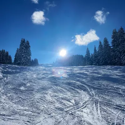 A ski slope taken against the light.